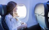 young-woman-looks-out-aircraft-window-during-flight-888418070-5b7ba7cbc9e77c00506f855f.jpg