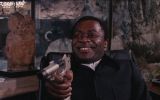 Live_and_Let_Die_-_Kananga_threatens_Bond_with_his_own_weapon-1.jpg