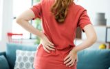 canva-young-woman-with-back-pain-900x600.jpg